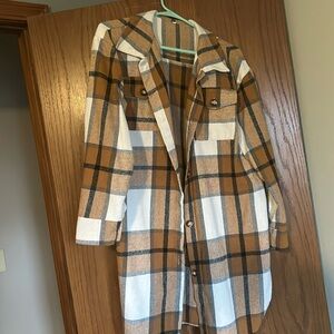 Size large plaid jacket. Flannel material. Warm. Used but in good condition.